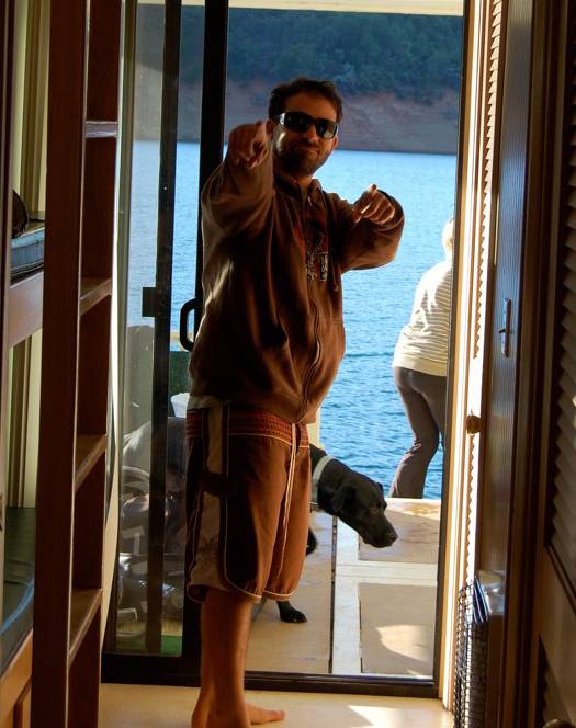 smiling man on shasta lake houseboat