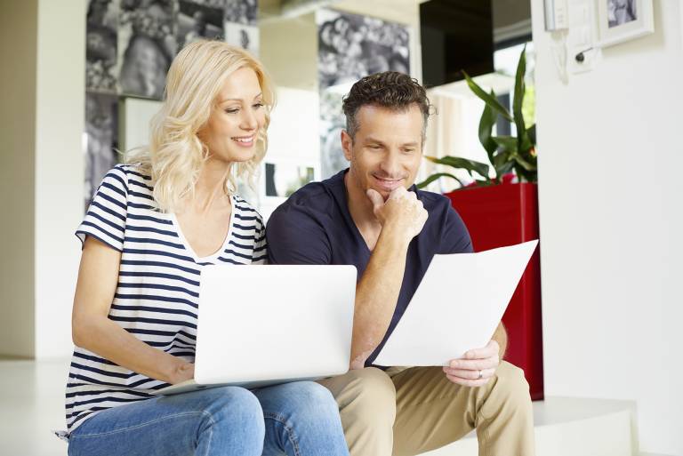 smiling couple reviews cost of houseboats