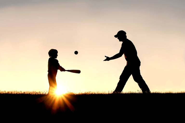 father son catch during houseboat vacation