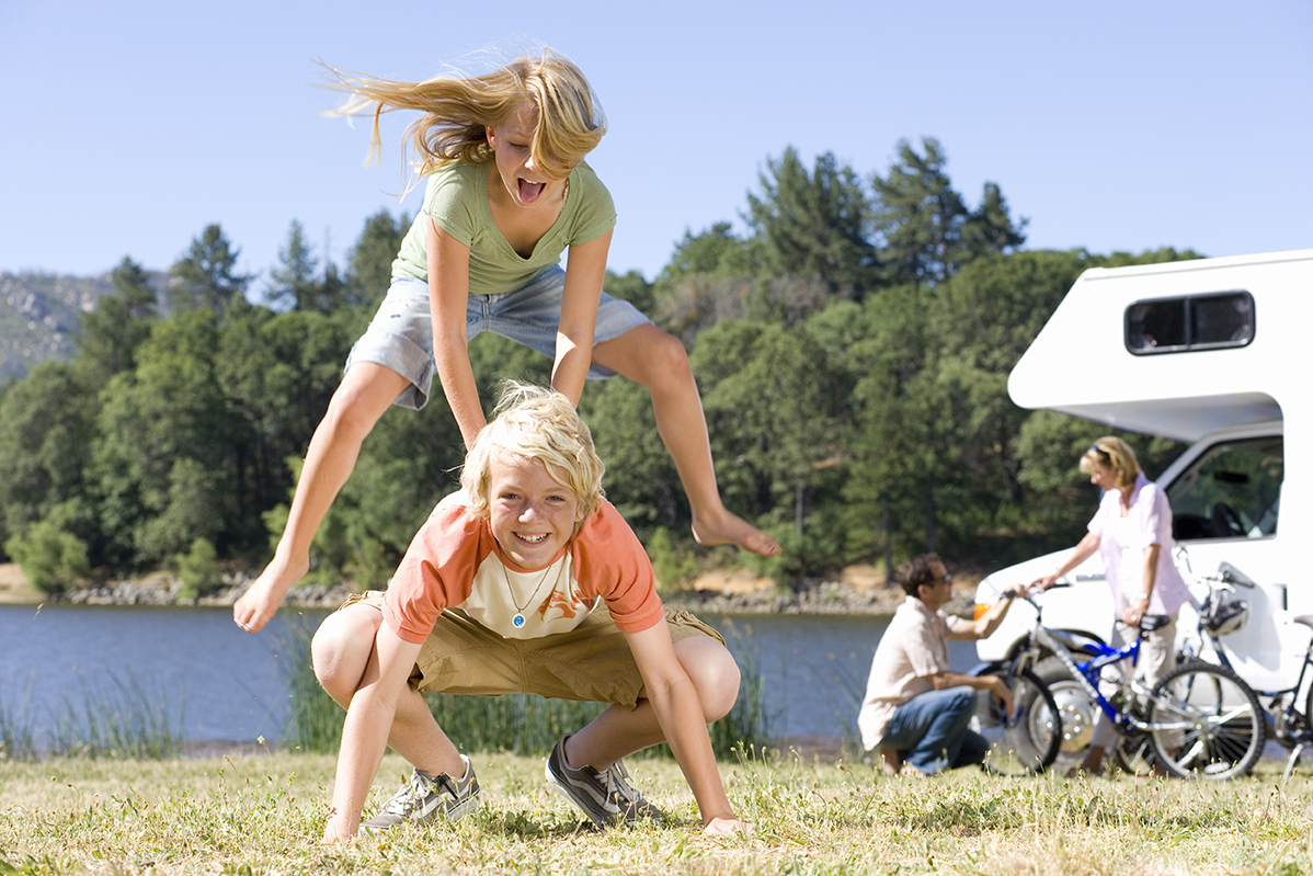 children play leapfrog at rv campground