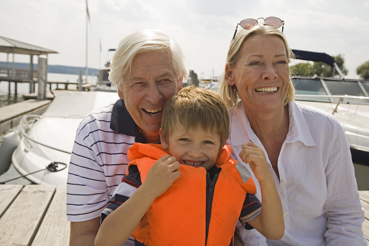 grandparents and grandson at lakeside marina